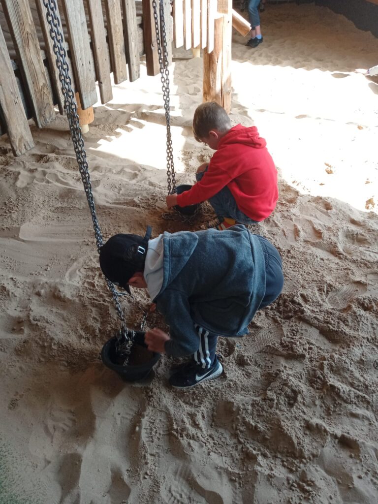 Kids playing in the sand at Williams Den